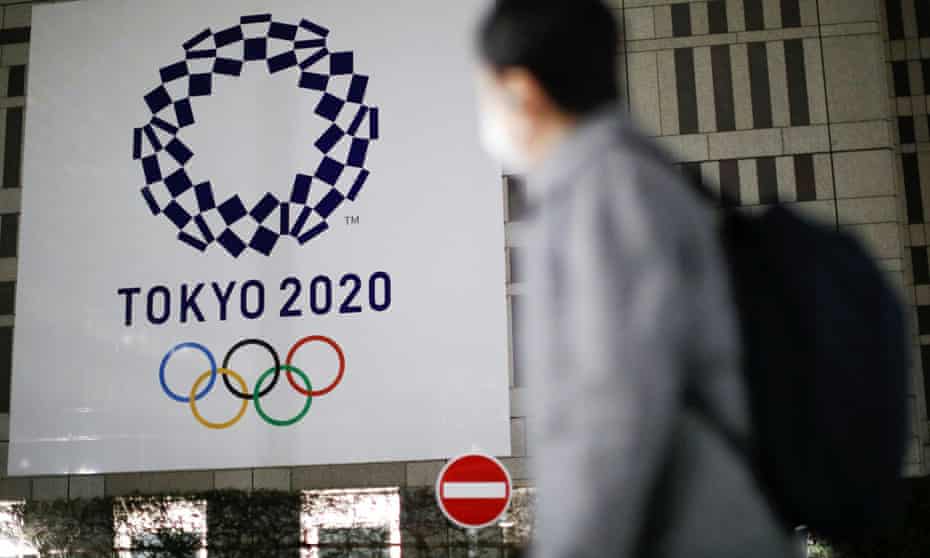 The logo of Tokyo 2020 Olympic Games is seen through signboards in the Japanese capital. 