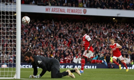 Arsenal's Bukayo Saka (C) celebrates scoring the team's third goal from the penalty spot