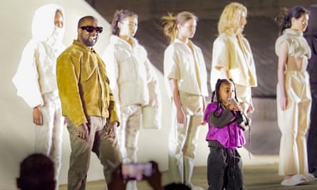 Kanye West and daughter North West attends the Yeezy Season 8 show as part of the Paris Fashion Week in March.