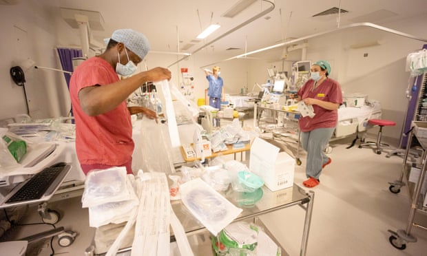 Hospital staff in London turning theatres and recovery departments into Covid wards on New Year’s Eve. 