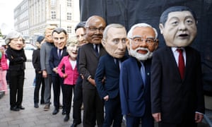 Protesters dressed like G20-leaders in Hamburg on Sunday.