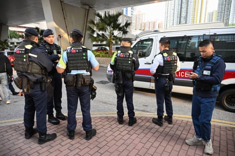 Police keep watch outside the West Kowloon Magistrates’ Court in Hong Kong on February 9, 2026, for the sentencing of convicted pro-democracy media tycoon Jimmy Lai.