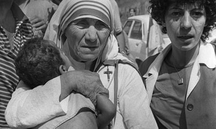 Mother Teresa carries a child in Beirut in August 1982.