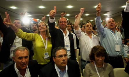 Supporters of the Portugal Ahead coalition listen to the first exit polls.