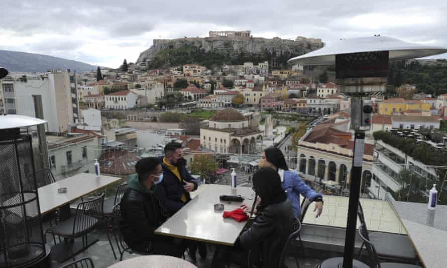 Outdoor diners in Athensm Greece, where those with no exemption who fail to get vaccinated face a recurring monthly fine of €100.