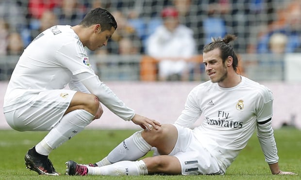 Gareth Bale goes down injured as Cristiano Ronaldo shows his concern.