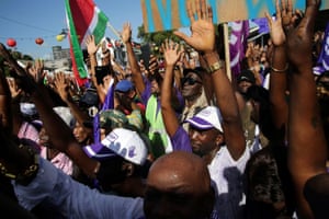 Supporters of Suriname’s President Desi Bouterse (not pictured) react as he addresses them after appearing in court in Paramaribo.