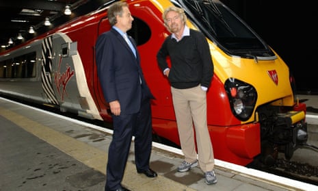 Tony Blair (left) with Virgin entrepreneur, Sir Richard Branson, at Euston Station, London, in 2004.