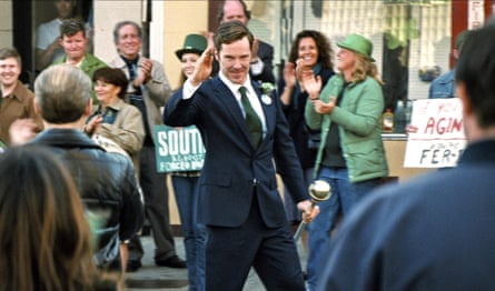 An American politician in a suit address a crowd.