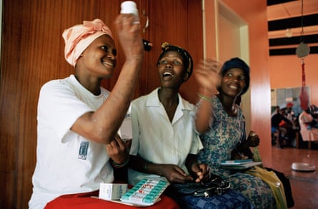 An HIV patient receives the antiretroviral drug Triomune, in South Africa.