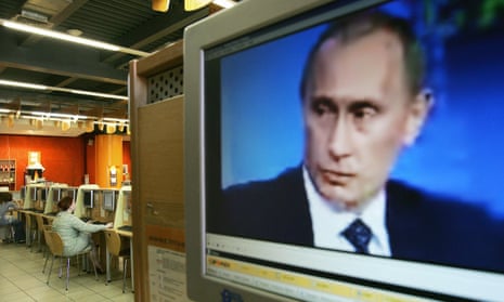 Vladimir Putin on a computer screen in an internet cafe.
