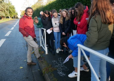 Boris Presseq and fellow botanists write chalk plant names on the pavement in Toulouse, France.
