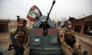 Iraqi pro-government forces patrol the eastern part of Mosul during the military operation against Islamic State militants.