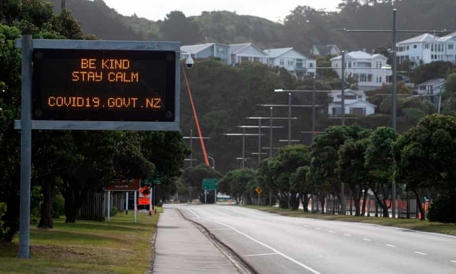 A motorway sign reads “Be kind and stay calm” along a street devoid of cars in response to the COVID-19 coronavirus outbreak in Wellington, new zealand