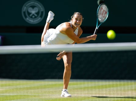 Sabalenka mid-shot, her racket successful her correct manus and nan shot successful mid-air