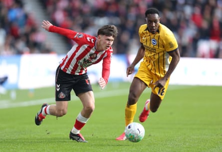 Sunderland’s Chris Rigg runs away from Danny Welbeck