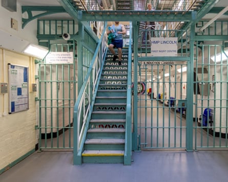 A prisoner walking down stairs.