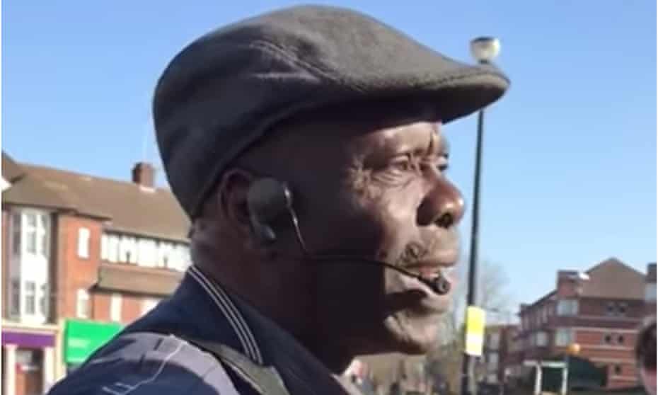 Oluwole Ilesanmi pleads with a police officer outside Southgate tube station. 
