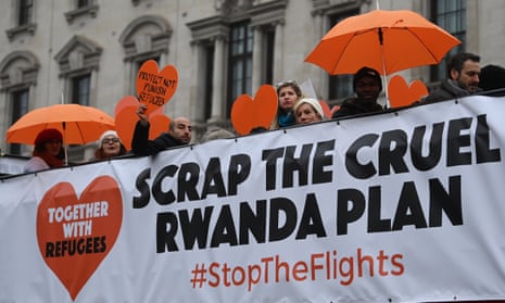 Activists in London protest against a plan to deport asylum seekers to Rwanda.