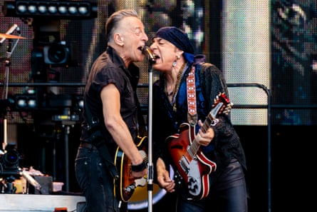 Bruce Springsteen and Steven Van Zandt share the mic.