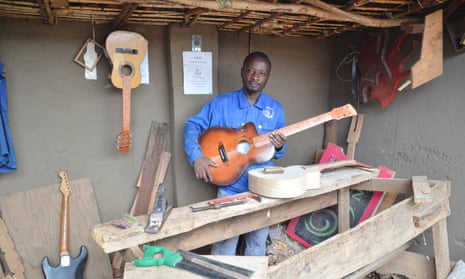 Patron Palushang, 36, is a guitar maker from Bukavu in the eastern Democratic Republic of the Congo. He has set up a business in Dzaleka. 