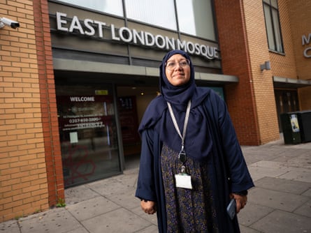 A woman standing outside a mosque