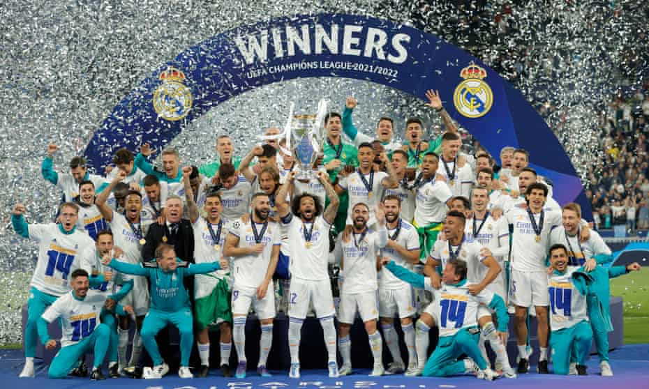 Marcelo lifts the trophy as Real Madrid celebrate their 14th European Cup after victory in Paris.
