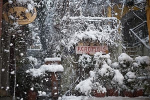 The popular tourist area of Plaka is seen in the snow.