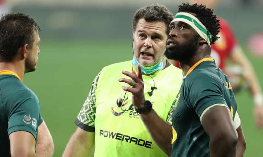South African rugby director Rassie Erasmus speaks with captain Siya Kolisi.