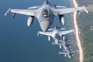 Lithuania. A Romanian air force F-16 military fighter jet (top) and its Portuguese counterparts participate in a Nato air-policing mission over the Baltic Sea
