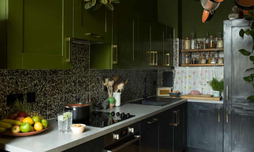 Cooking up a storm: green and black painted units in the kitchen.
