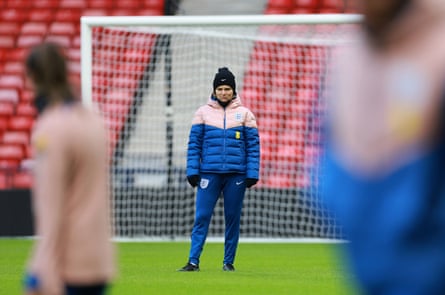 The England head coach Sarina Wiegman oversees training.