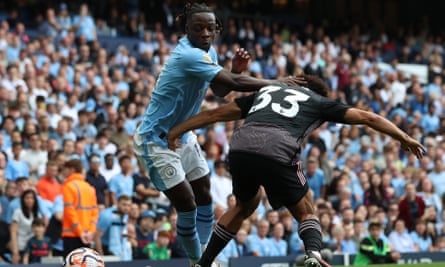 Jérémy Doku tries to escape a defender during Manchester City’s victory against Fulham