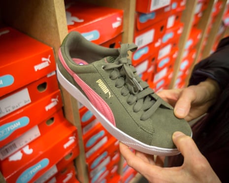 A Puma brand trainer in a shoe store in New York