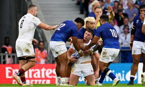 Owen Farrell of England clashes with Danny Toala of Samoa as the half-time whistle goes.