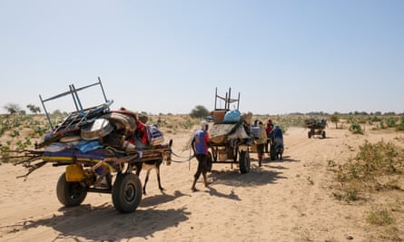 Sudanese refugees crossing the border into Chad.