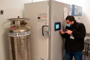Coronavirus live news: UK records 21,502 new cases and 519 deaths; Peru suspends trials of China vaccine | World news 4 A technician is making adjustments to the vaccine freezer at Mount Sinai hospital in New York on 9 December 2020, ahead of an expected Pfizer COVID-19 vaccine shipment over the weekend. An initial shipment of 975 doses, to be stored in this freezer at -80 degrees celsius (-112 Fahrenheit), will be administered to hospital workers including ICU, ER and EMS staff.