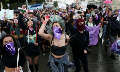 People attend a protest to mark the International Day for the elimination of violence against women, in Bogotá, Colombia, on 25 November.