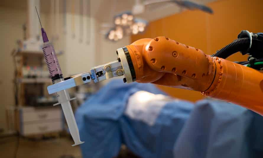 Robot arm holds a syringe