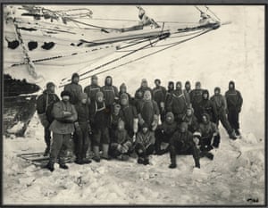 Officers and crew of the Endurance pose under the bow on Endurance