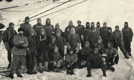 Officers and crew of the Endurance under the ship’s bow at Weddell Sea Base during the Imperial Trans-Antarctic Expedition, 1914-17.