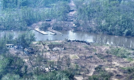 An aerial view of burnt vehicles across the Siverskyi Donets River.