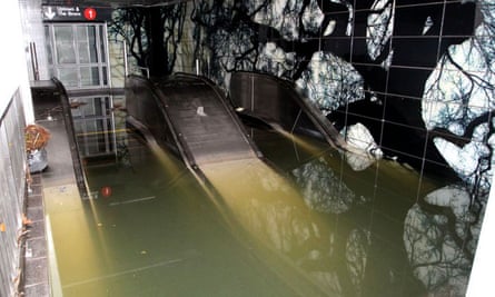 An escalator under water at a subway station in New York after Hurricane Sandy