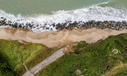 A road disappears in to the sea due to coastal erosion. Photographer: Jason Alden/Bloomberg