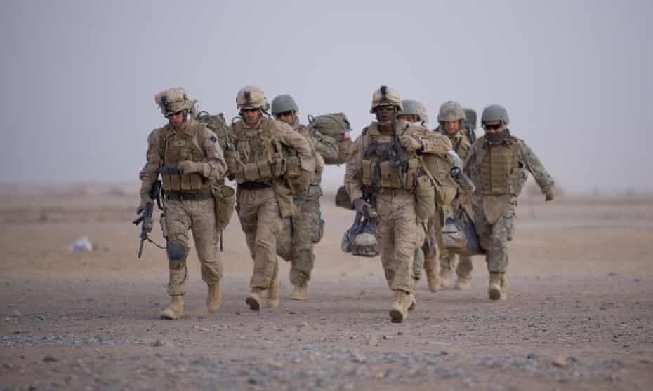 US marines walk towards helicopter transport at Camp Dwyer in Helmand province, Afghanistan. The US government stopped publishing troop levels in the country in 2017.