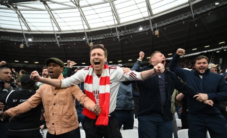 Arsenal fans celebrate in the away end at the London Stadium after the decision to rule out West Ham’s leveller