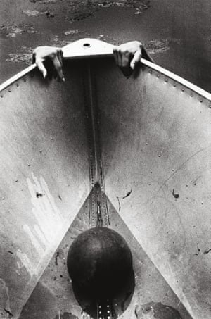 Hands appearing over the edge of a boat