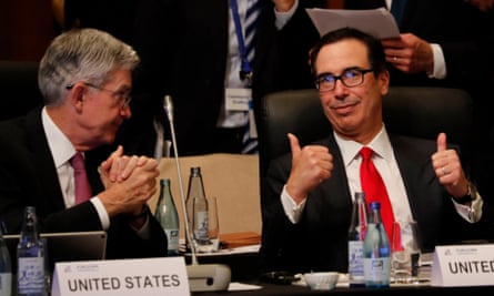 Steven Mnuchin gestures as he talks with Federal Reserve chairman Jerome Powell in Fukuoka, Japan.