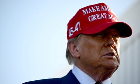 Man wearing baseball cap looks to side