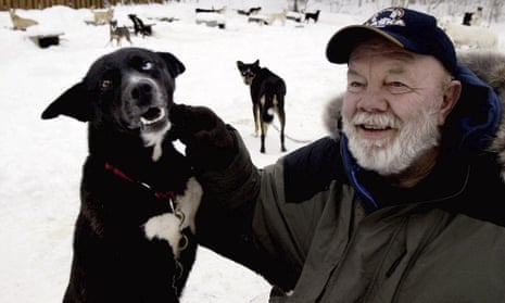 Gary Paulsen sits with his favorite Alaskan husky, Flax, at his Willow, Alaska, home in 2005. 